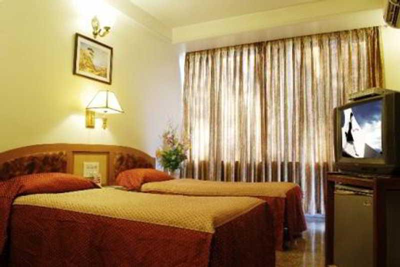 Hotel Mandakini Ambience Pune Zimmer foto